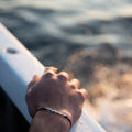 ël_Beirut bracelet in sand-blasted silver with a black-thread