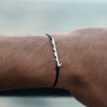 ël_Habibi bracelet in brushed silver with a black thread